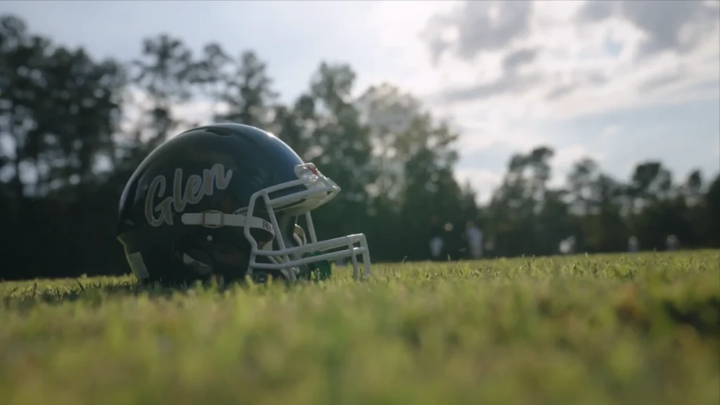 Football helmet resting on the field before a middle school football game