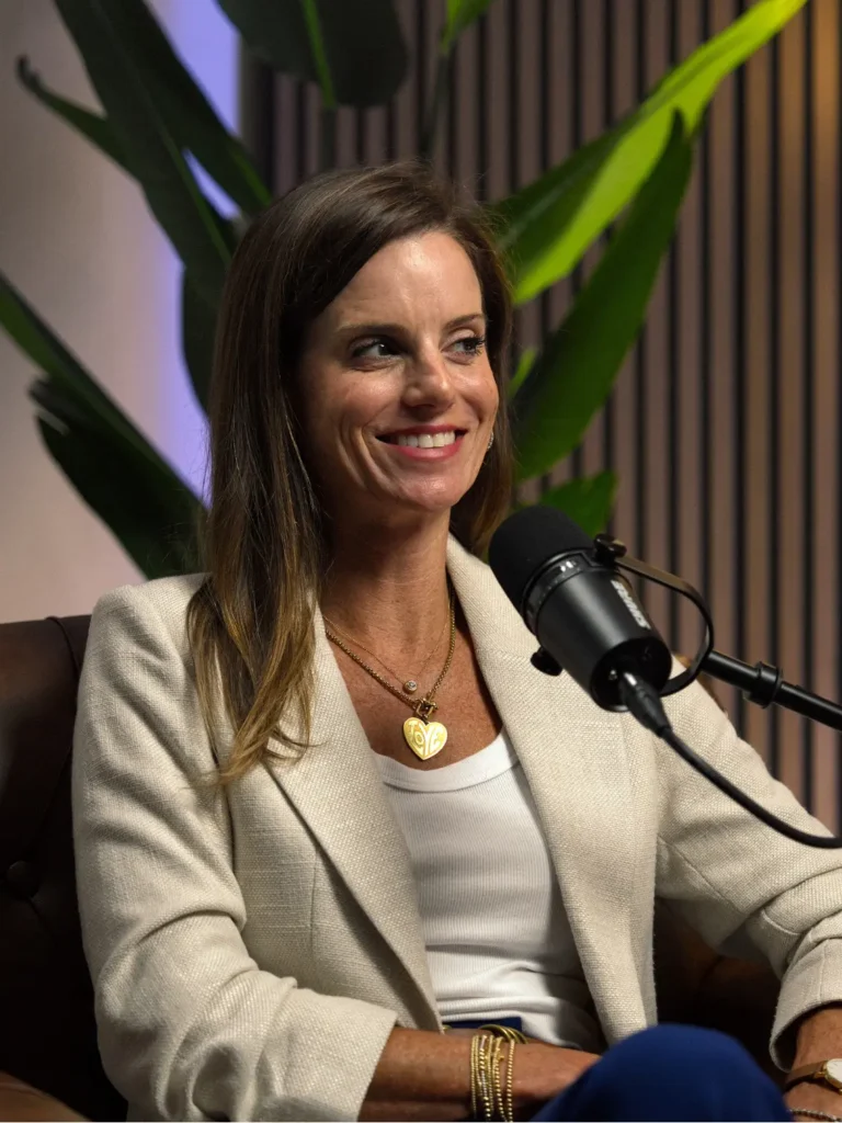 Business professional speaking into a microphone during a 60 for 60™ content session at OneSixEight Productions.